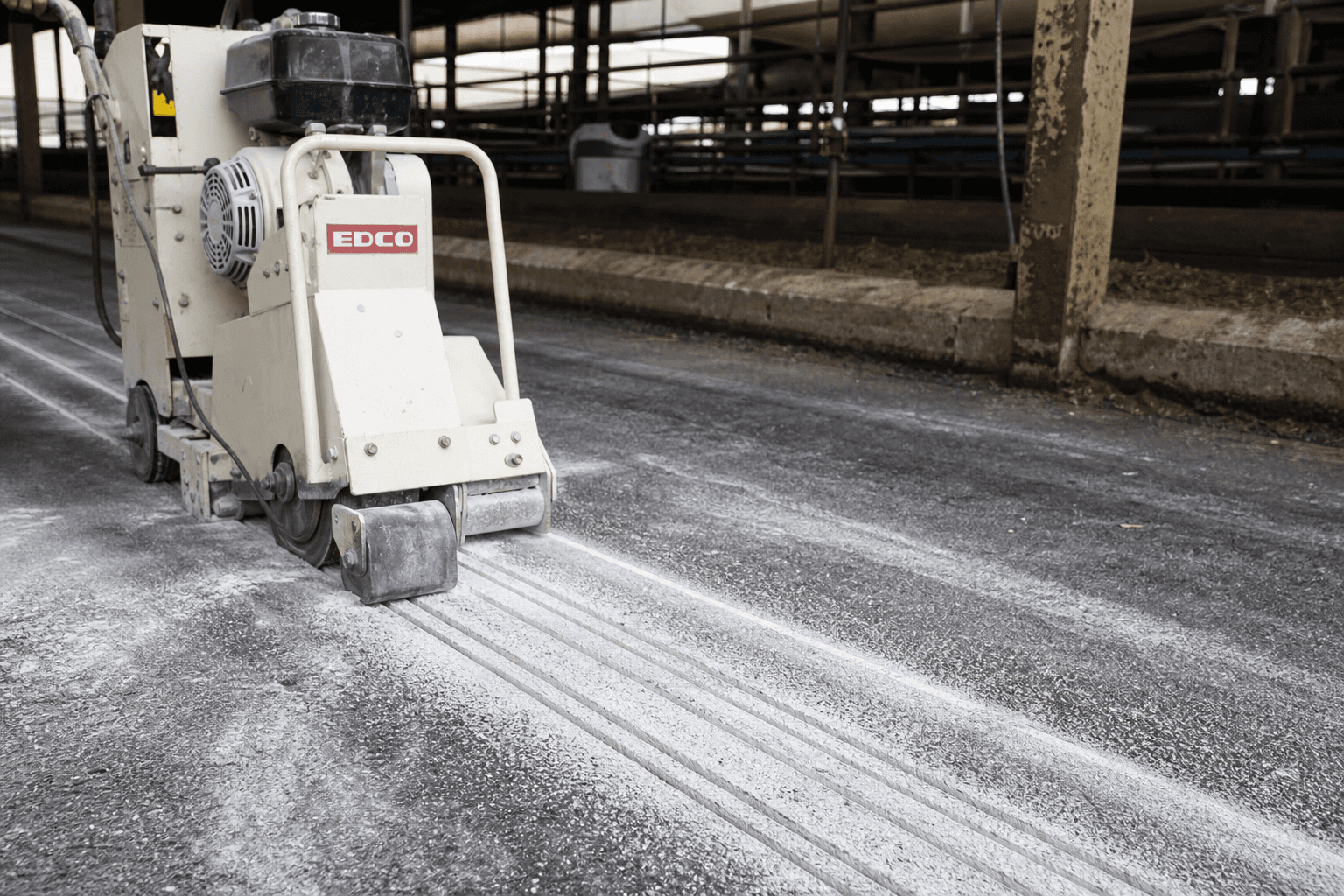EDCO diamond-blade grooving saw cutting grooves in a barn alley