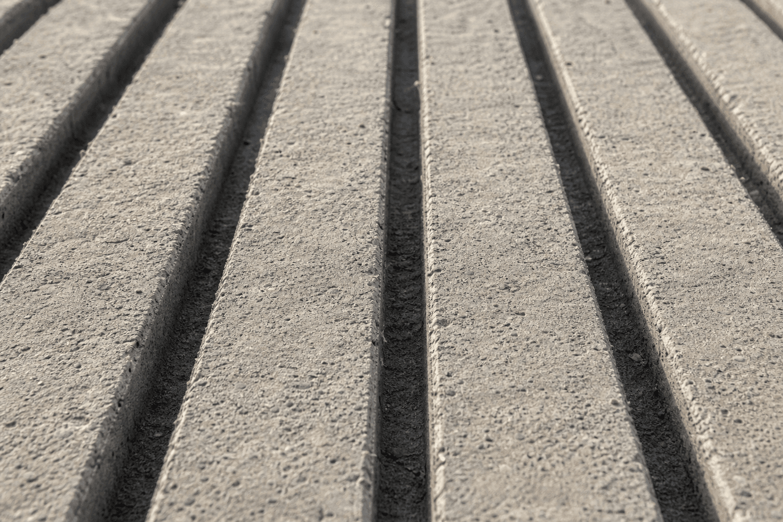 Close-up of square-edged straight-line concrete grooving